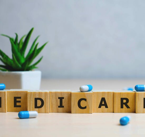MEDICARE word made with building blocks, medical concept background